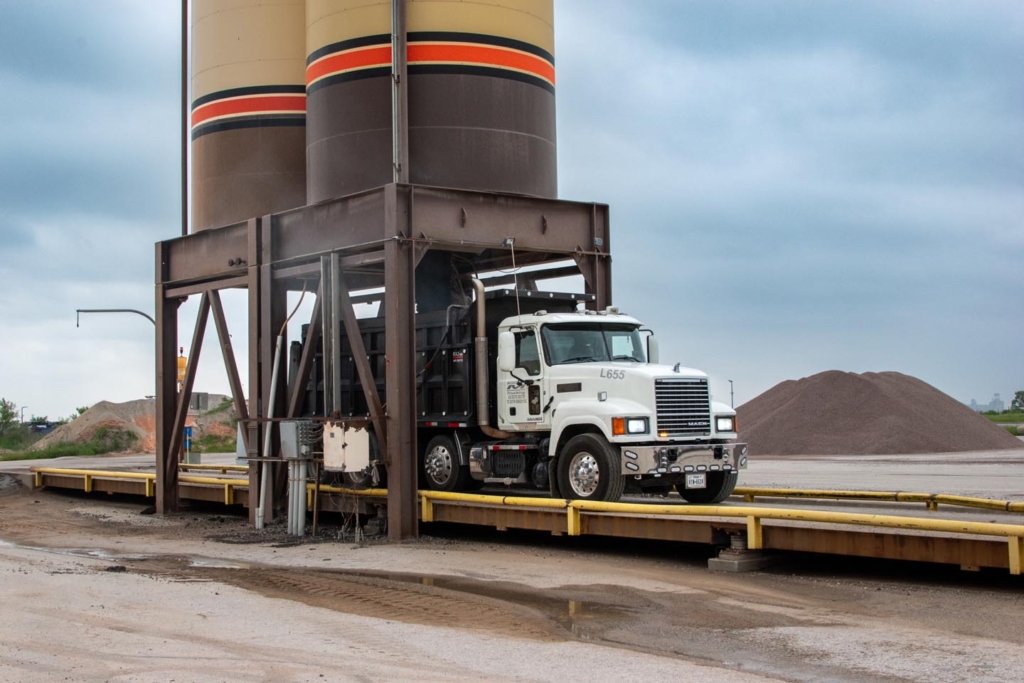 Dump truck being filled with aggregate • Photo by Mary-Ann Zykin