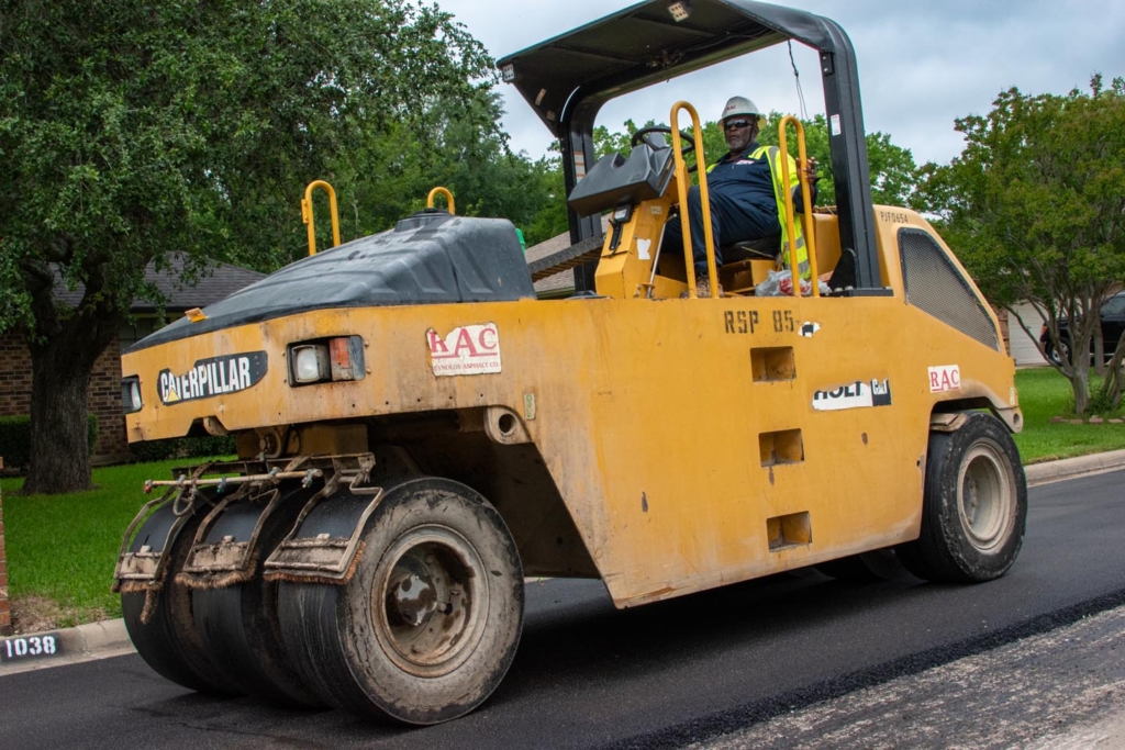 Construction worker paving an asphalt road • Photo by Mary-Ann Zykin