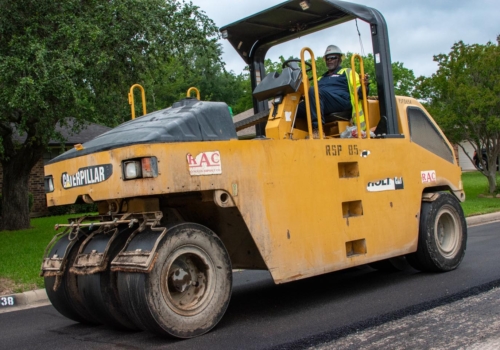 Construction worker paving an asphalt road • Photo by Mary-Ann Zykin