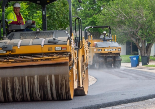 Construction workers driving road rollers • Photo by Mary-Ann Zykin