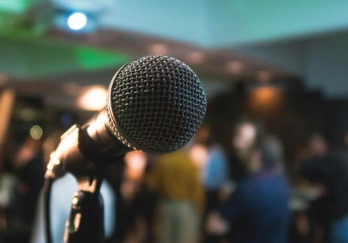 Microphone in front of a crowd.