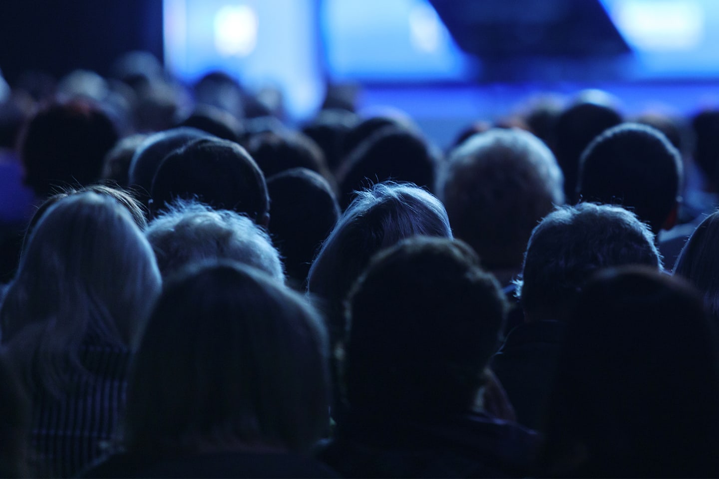 Group of people listening to a presenter.