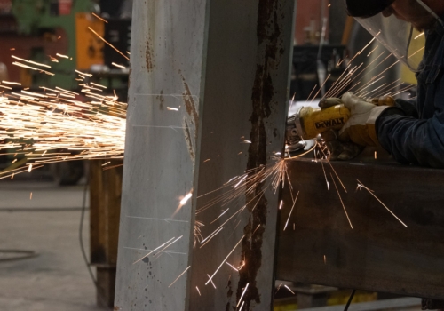 Photo of metal being cut with sparks flying