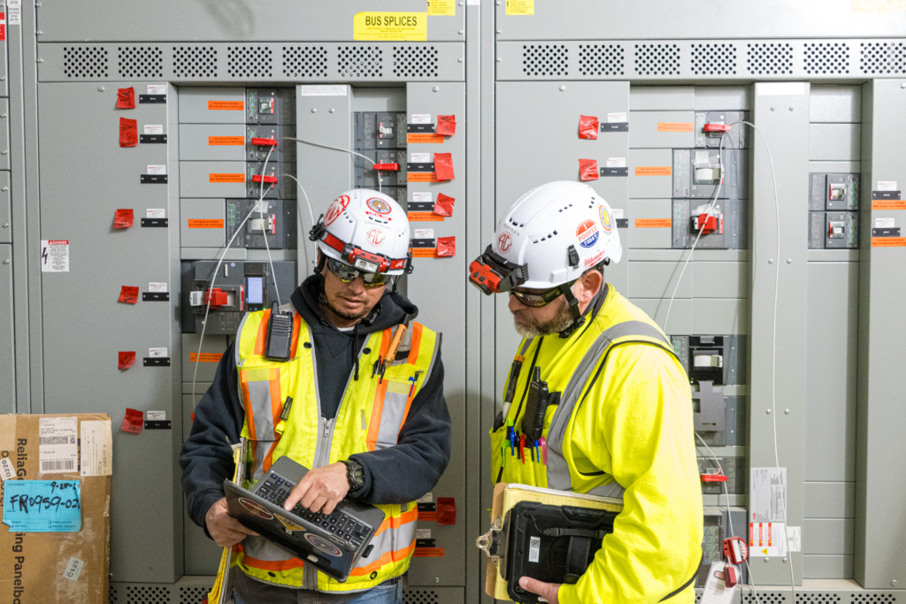 Electrical workers having a conversation