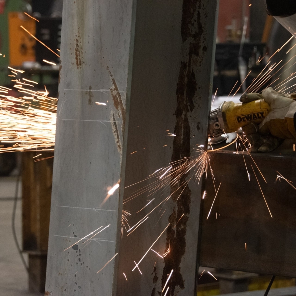 Photo of metal being cut with sparks flying