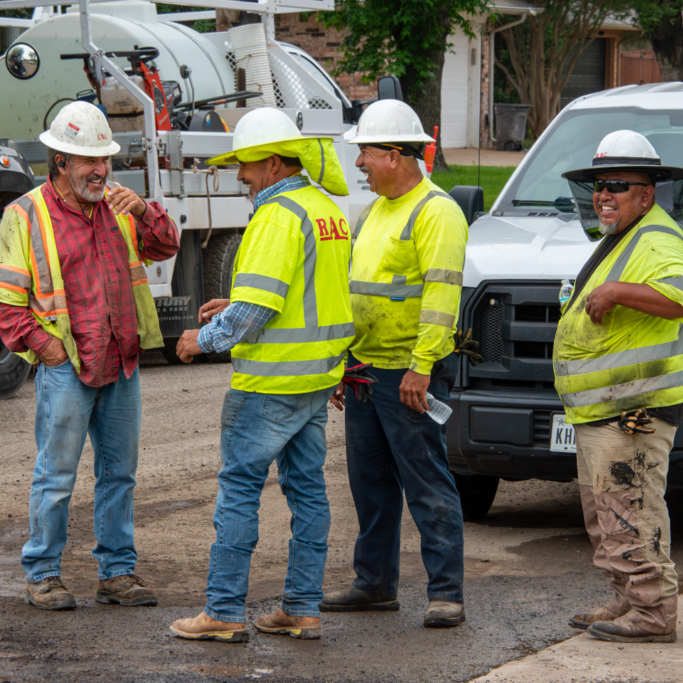 Construction workers talking in a group